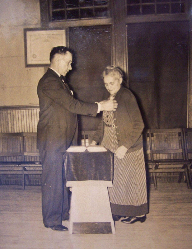 Librarian Adelia Loomis receiving award for selling War Bonds
from William Johnson, Savings Bank of Manchester