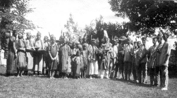 Mohegan youths and their leader participating in a powwow on the Bolton town green in 1920 to celebrate the 200th anniversary of the founding of Bolton. <br/>Mary Gleason Sumner appears to be the third person on the leader's left. Photo courtesy Genevieve Robb.